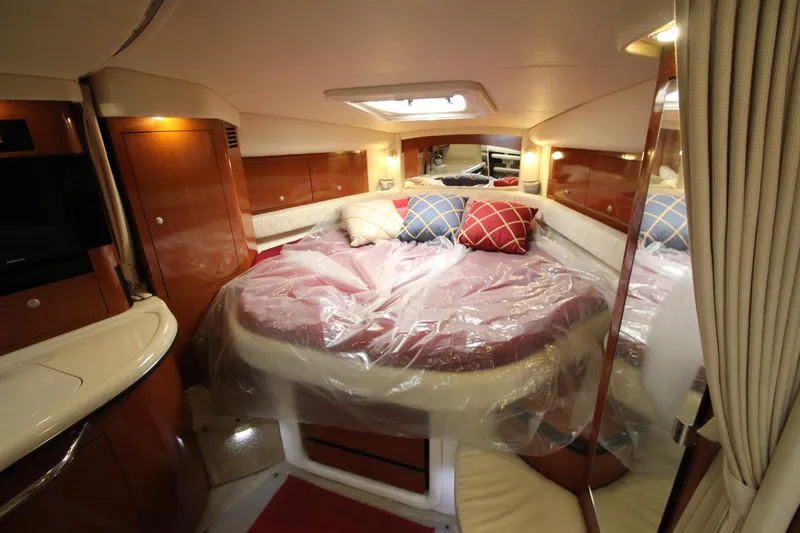 Slide: The Image of Interior of 2005 Sea Ray 340 Sundancer yacht with cozy bed and elegant wood finish. - 10