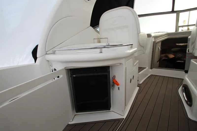 Slide: The Image of 2005 Sea Ray 340 Sundancer interior with kitchenette and seating area. - 32