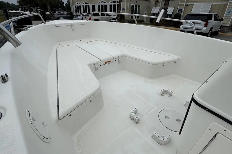 Slide: The Image of 2007 Hydra-Sports Lightning 180 CC boat interior with white seating and storage compartments. - 12