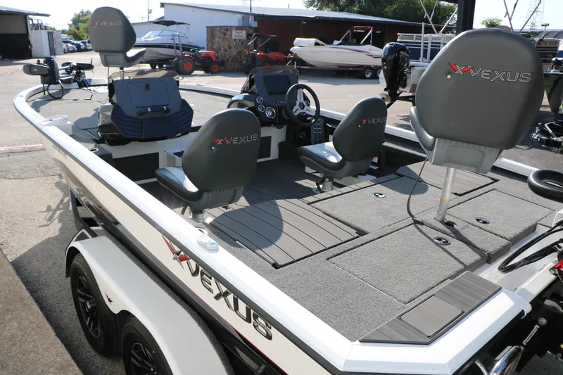 Slide: The Image of 2025 Vexus AVX 1985s fishing boat with modern seating and spacious deck layout. - 11