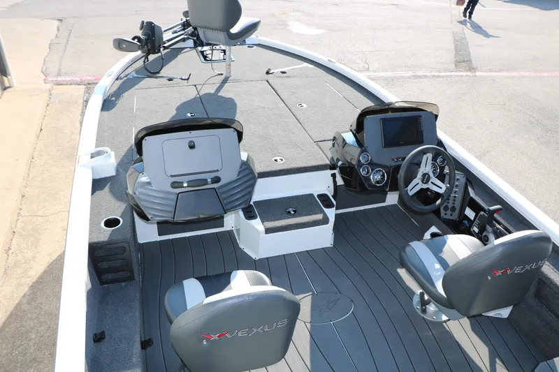 Slide: The Image of 2025 Vexus AVX 1985s boat interior with modern dashboard and seating. - 12
