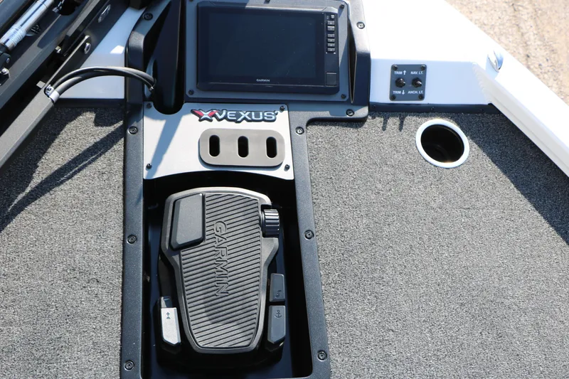 Slide: The Image of 2025 Vexus AVX 1985s boat dashboard with Garmin pedal and control panel. - 17
