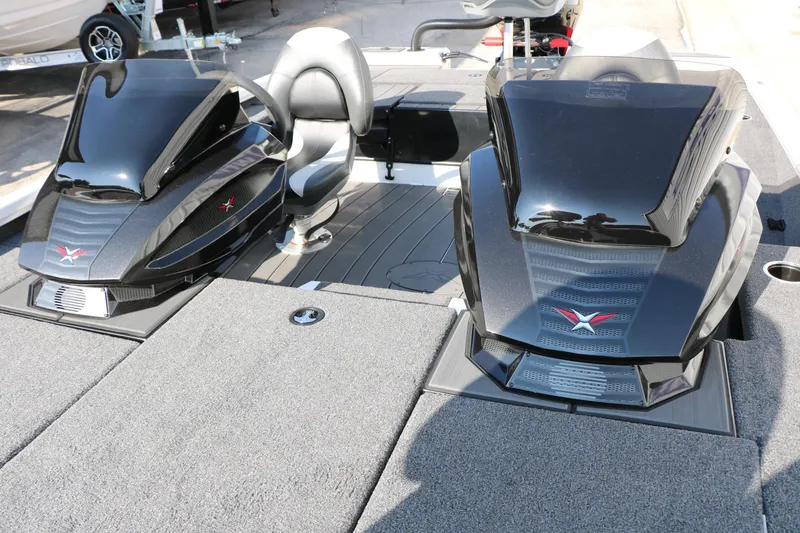 Slide: The Image of 2025 Vexus AVX 1985s boat interior with sleek black consoles and seating. - 19