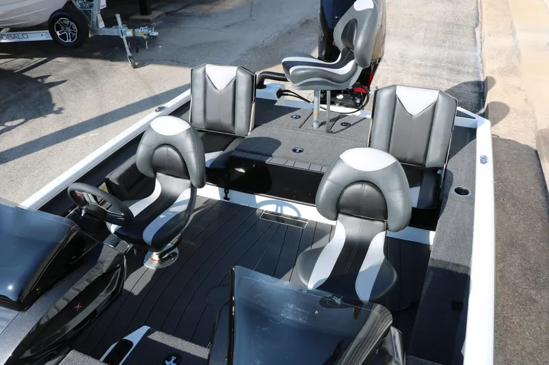 Slide: The Image of 2025 Vexus AVX 1985s boat interior with sleek black and white seating design. - 21