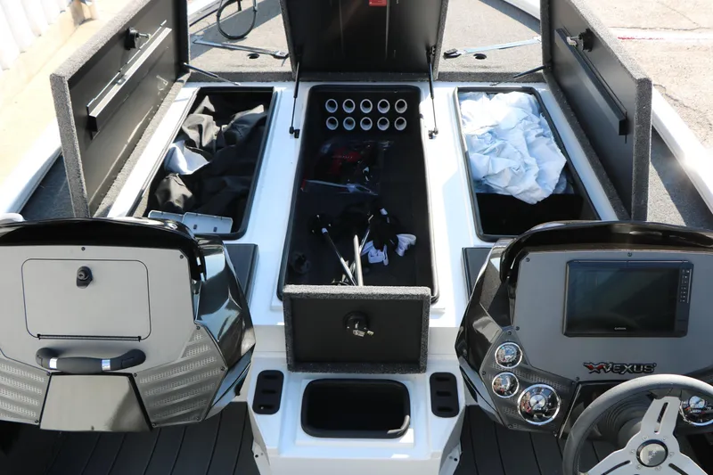 Slide: The Image of 2025 Vexus AVX 1985s boat interior with storage compartments and control panels. - 24