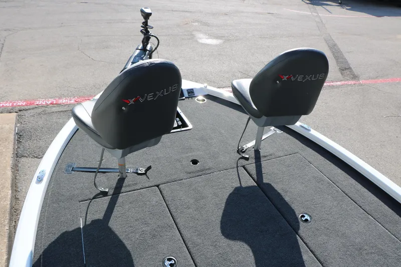 Slide: The Image of 2025 Vexus AVX 1985s boat deck with two seats and fishing equipment. - 26