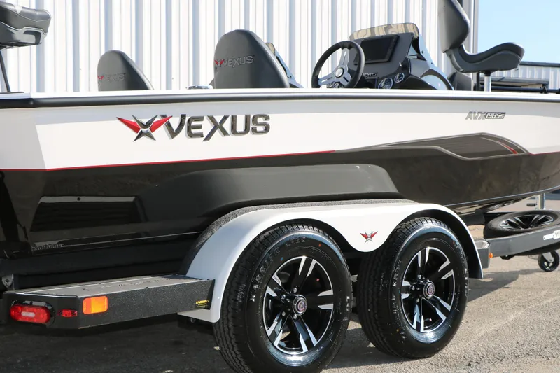 Slide: The Image of 2025 Vexus AVX 1985s boat on trailer, showcasing sleek design and modern features. - 3