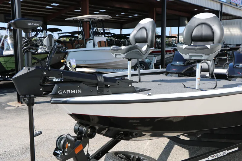 Slide: The Image of 2025 Vexus AVX 1985s boat with Garmin equipment, featuring dual seats and sleek design. - 34