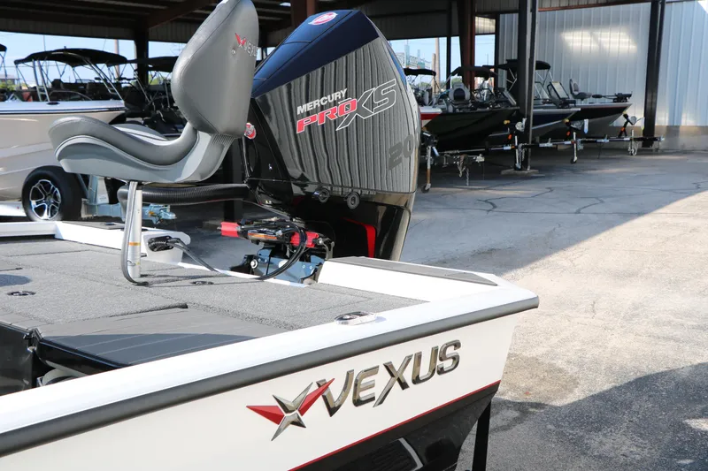 Slide: The Image of 2025 Vexus AVX 1985s boat with Mercury Pro XS engine in a showroom. - 7