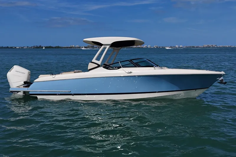 The Image of 2026 Chris-Craft Sportster 28 boat on water, featuring sleek design and modern outboard motor. - 0