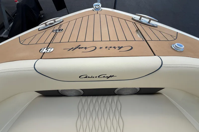 Slide: The Image of 2026 Chris-Craft Sportster 28 boat interior with elegant wood and leather detailing. - 10