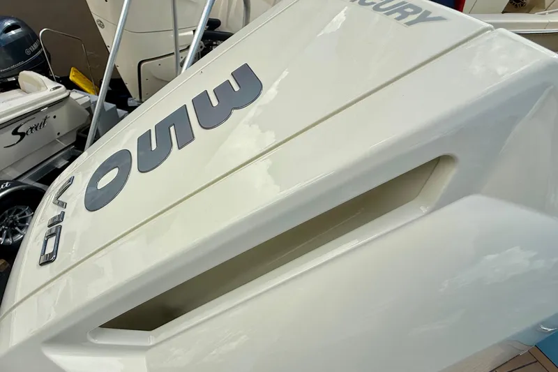 Slide: The Image of 2026 Chris-Craft Sportster 28 with Mercury outboard engine, showcasing sleek design and branding. - 15