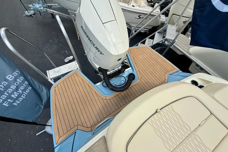 Slide: The Image of 2026 Chris-Craft Sportster 28 with Mercury engine, featuring teak deck and luxurious seating. - 3