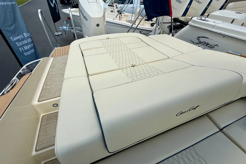 Slide: The Image of 2026 Chris-Craft Sportster 28 boat with luxurious beige seating and elegant design. - 55