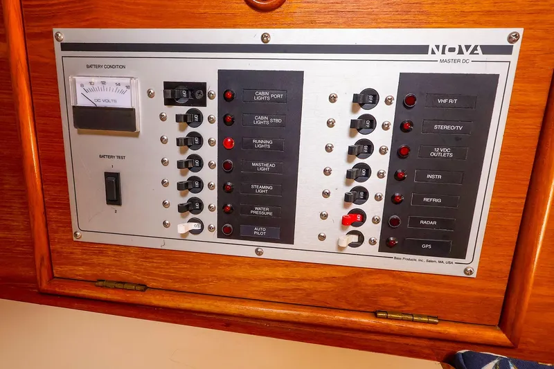 Slide: The Image of Electrical control panel on a 1988 Nonsuch 30 Ultra sailboat, featuring various switches and indicators. - 18