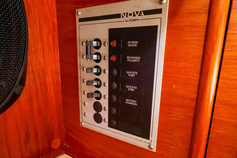Slide: The Image of Electrical panel on 1988 Nonsuch 30 Ultra sailboat, featuring AC power controls. - 19