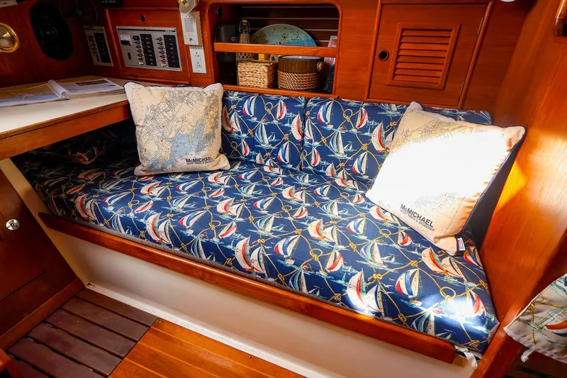 Slide: The Image of Cozy cabin interior of 1988 Nonsuch 30 Ultra with nautical-themed cushions. - 8