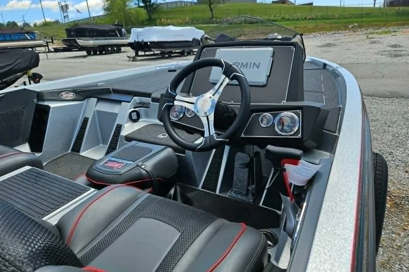 Slide: The Image of 2025 Ranger Z518 Cup-Equipped boat interior with steering wheel and Garmin display. - 11