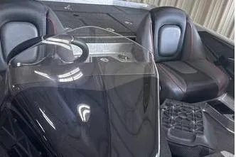 Slide: The Image of 2025 Ranger Z518 Cup-Equipped boat interior with sleek black seats and steering console. - 5