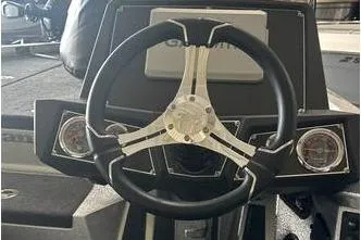 Slide: The Image of 2025 Ranger Z518 Cup-Equipped boat steering wheel and dashboard close-up. - 8