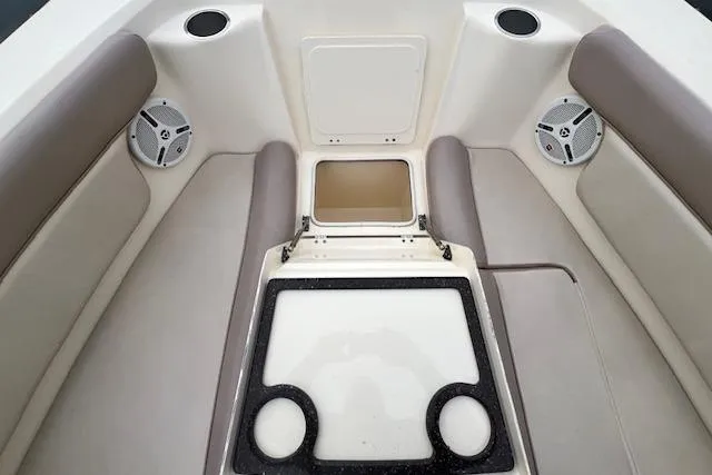 Slide: The Image of 2008 Scout 242 Dorado boat interior with seating and storage compartments. - 16