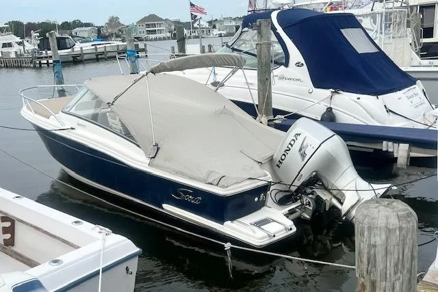 Slide: The Image of 2008 Scout 242 Dorado boat with Honda outboard motor docked in marina. - 3