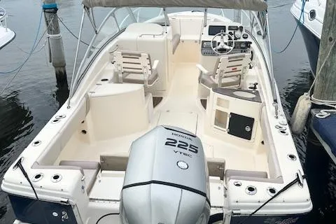 Slide: The Image of 2008 Scout 242 Dorado boat with Honda 225 VTEC engine, docked at marina. - 5