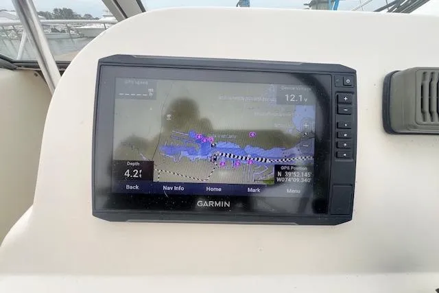 Slide: The Image of Garmin navigation system on 2008 Scout 242 Dorado boat dashboard, displaying nautical map. - 7