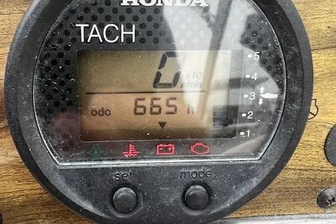 Slide: The Image of Honda tachometer displaying 665 hours on a 2008 Scout 242 Dorado boat. - 8
