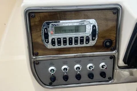 Slide: The Image of Control panel of 2008 Scout 242 Dorado boat with switches and digital display. - 9