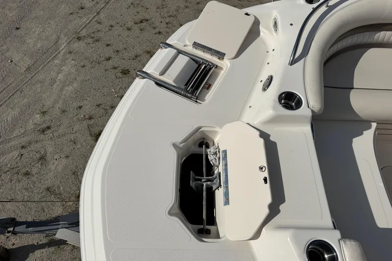 Slide: The Image of 2008 Hurricane SunDeck 195 OB boat deck with anchor and seating area. - 10