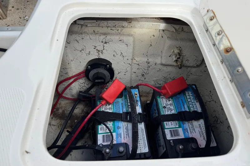 Slide: The Image of Battery compartment of a 2008 Hurricane SunDeck 195 OB boat with dual marine batteries. - 18