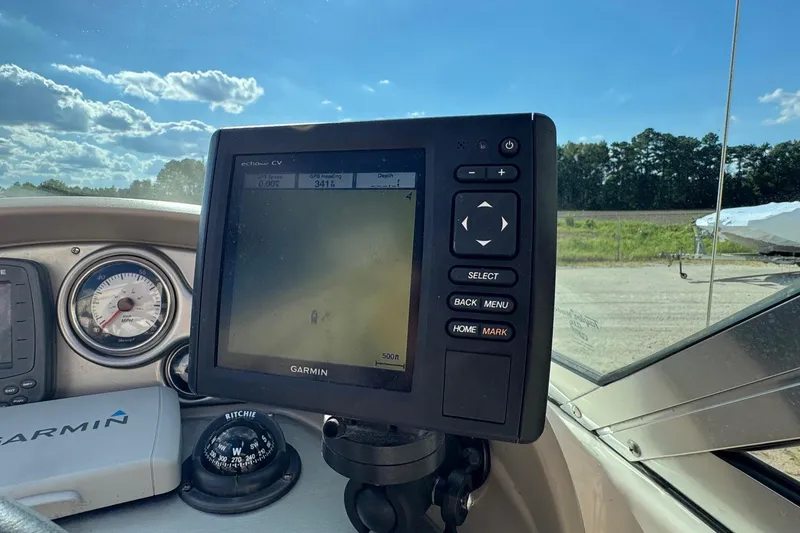 Slide: The Image of Garmin GPS on 2008 Hurricane SunDeck 195 OB boat dashboard under clear blue sky. - 9