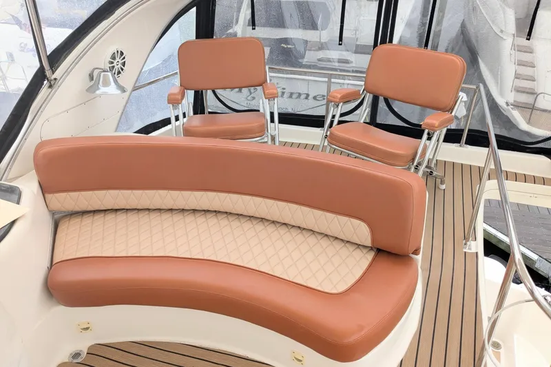 Slide: The Image of Luxurious seating on 2004 Meridian 411 yacht with tan leather and wood accents. - 10