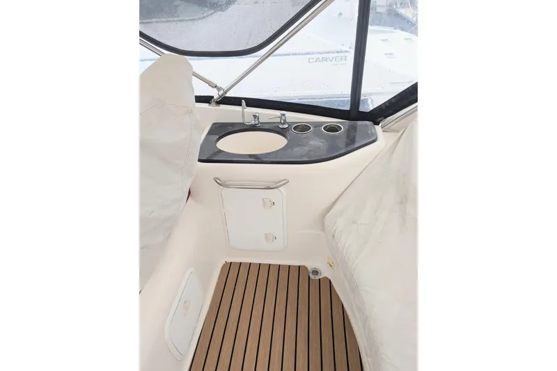 Slide: The Image of 2004 Meridian 411 yacht interior with sink, countertop, and wooden flooring. - 11