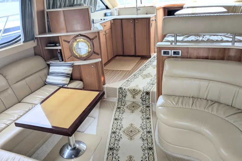 Slide: The Image of Luxurious interior of 2004 Meridian 411 yacht with leather seating and elegant decor. - 14