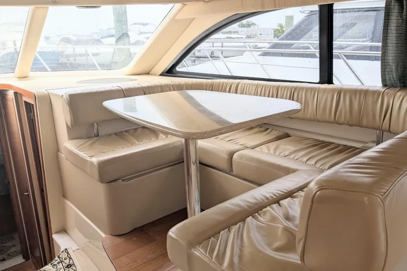 Slide: The Image of Luxurious interior of 2004 Meridian 411 yacht with leather seating and dining table. - 17