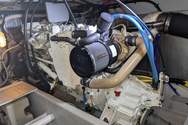 Slide: The Image of Engine compartment of a 2004 Meridian 411 yacht, showcasing detailed mechanical components. - 30