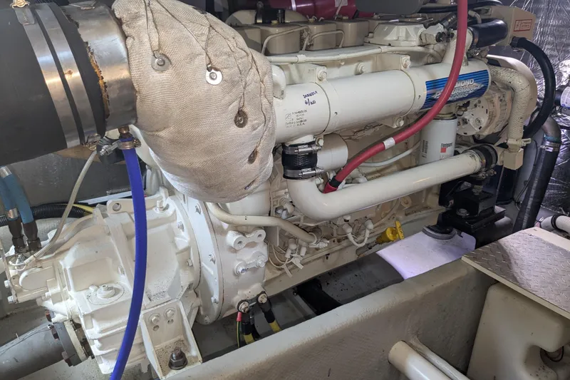 Slide: The Image of Engine of a 2004 Meridian 411 yacht, showcasing detailed mechanical components. - 32