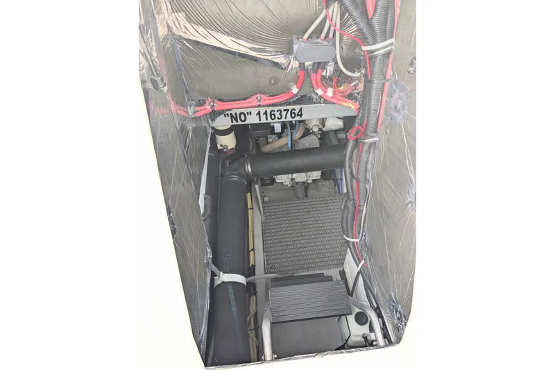 Slide: The Image of Engine compartment of a 2004 Meridian 411 boat, showing wiring and components. - 34