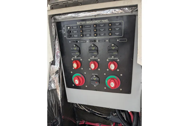 Slide: The Image of Battery management panel on a 2004 Meridian 411 boat, featuring switches and controls. - 35