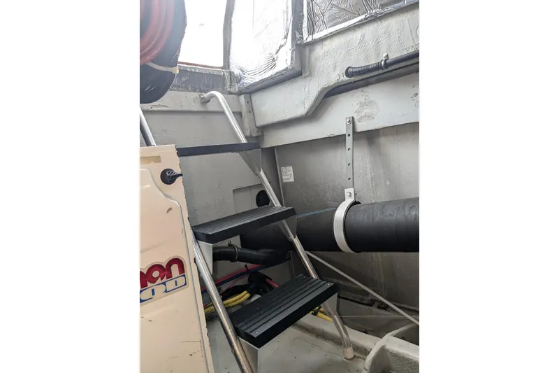 Slide: The Image of Engine room of 2004 Meridian 411 yacht with ladder and equipment. - 36