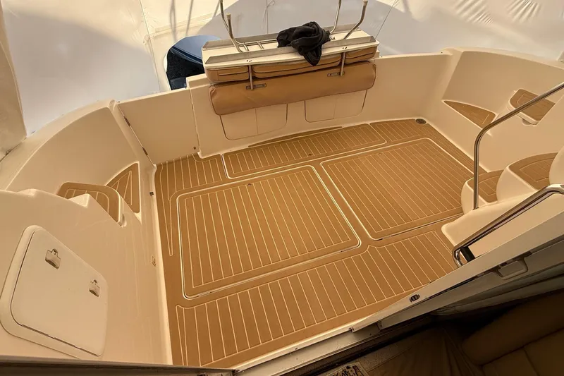 Slide: The Image of 2004 Meridian 411 boat interior with teak flooring and seating area. - 39
