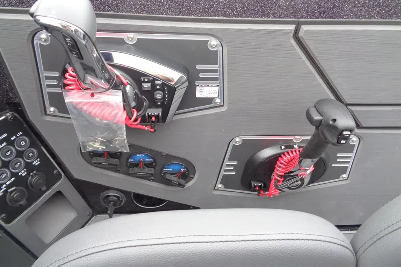 Slide: The Image of Control panel of 2026 Vexus DVX22S boat with throttle and joystick. - 11