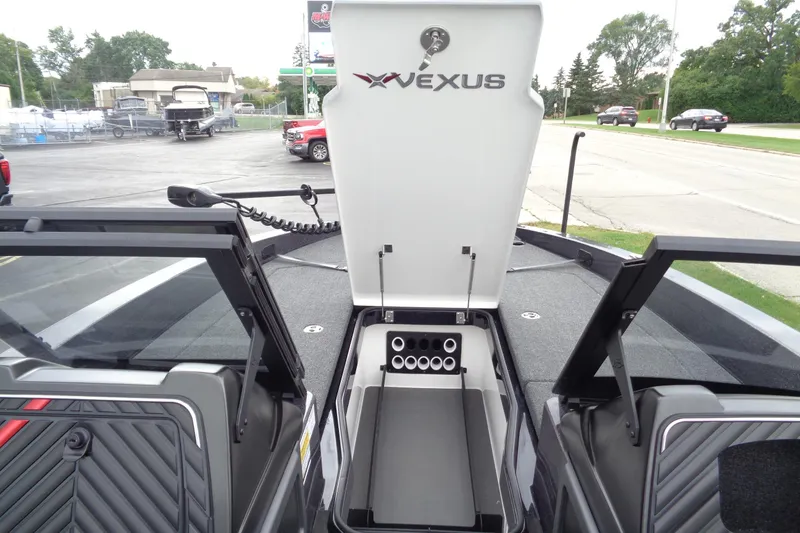 Slide: The Image of 2026 Vexus DVX22S boat interior with open storage compartment and sleek design. - 15