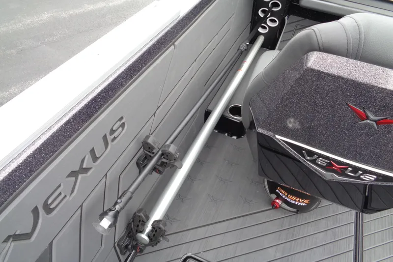 Slide: The Image of 2026 Vexus DVX22S boat interior with rod holders and branded seating. - 17