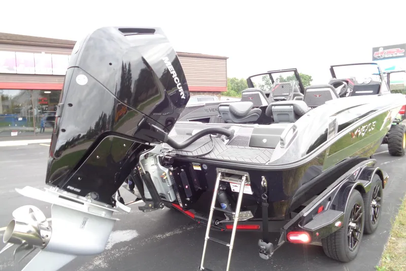 Slide: The Image of 2026 Vexus DVX22S boat with Mercury engine, parked on a trailer. - 26