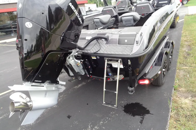 Slide: The Image of 2026 Vexus DVX22S boat with Mercury engine, rear view on trailer. - 27
