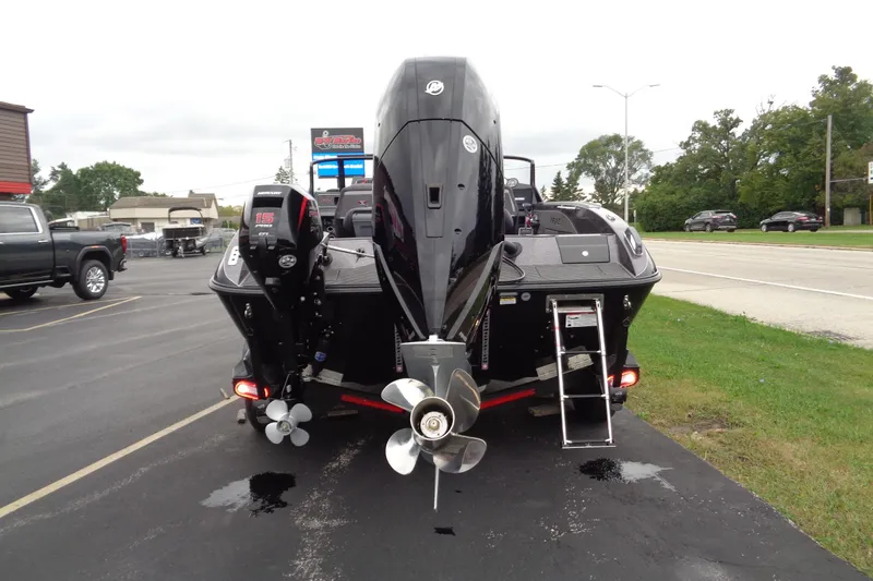 Slide: The Image of 2026 Vexus DVX22S boat rear view with dual outboard motors and ladder. - 28