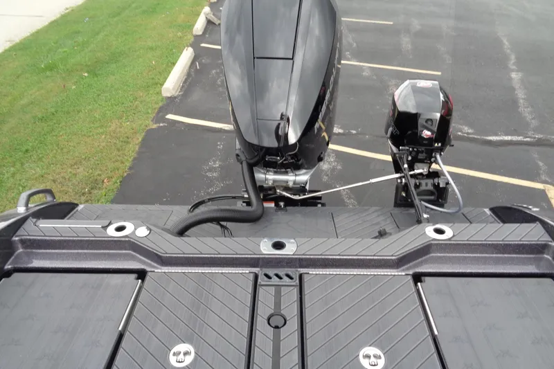 Slide: The Image of 2026 Vexus DVX22S boat with dual outboard motors in a parking lot. - 7